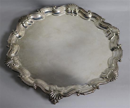 A silver salver, with shell, scroll and piecrust edge Dia 35cm; 41oz